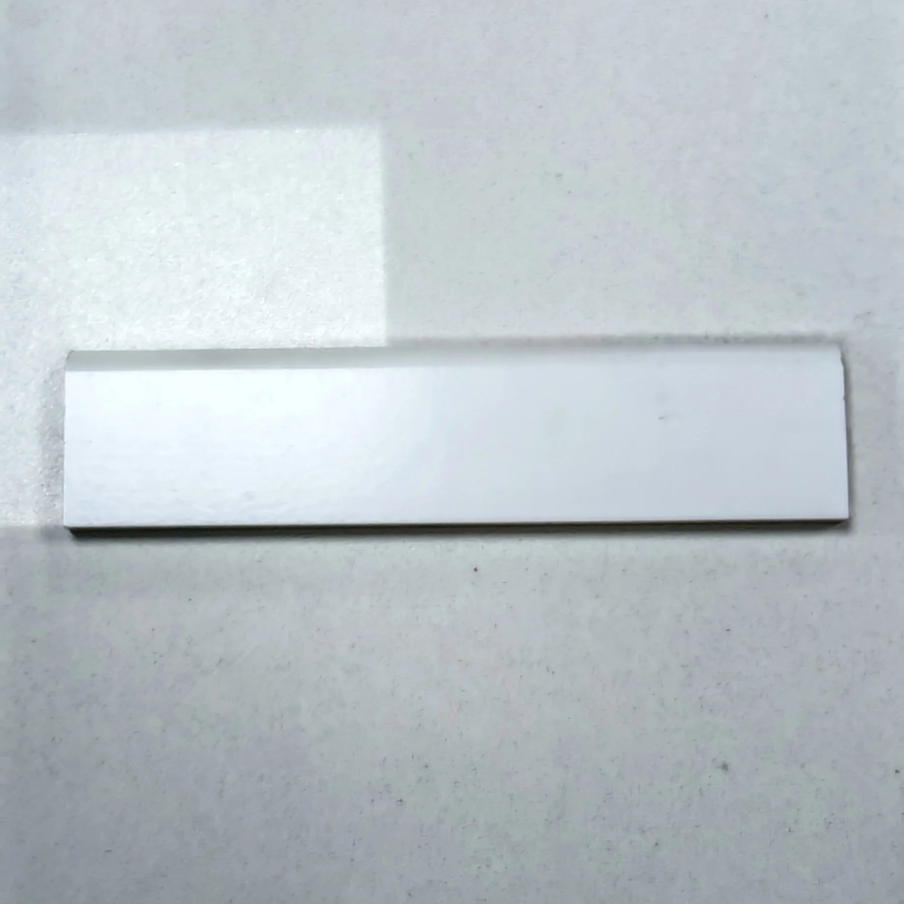 Guardapolvo MDF Laminado Veta Madera Blanco 12mm x 70mm x 2.4m